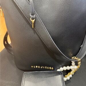 Marc Jacobs Black Crossbody Bag with Gold Accents along with small wallet